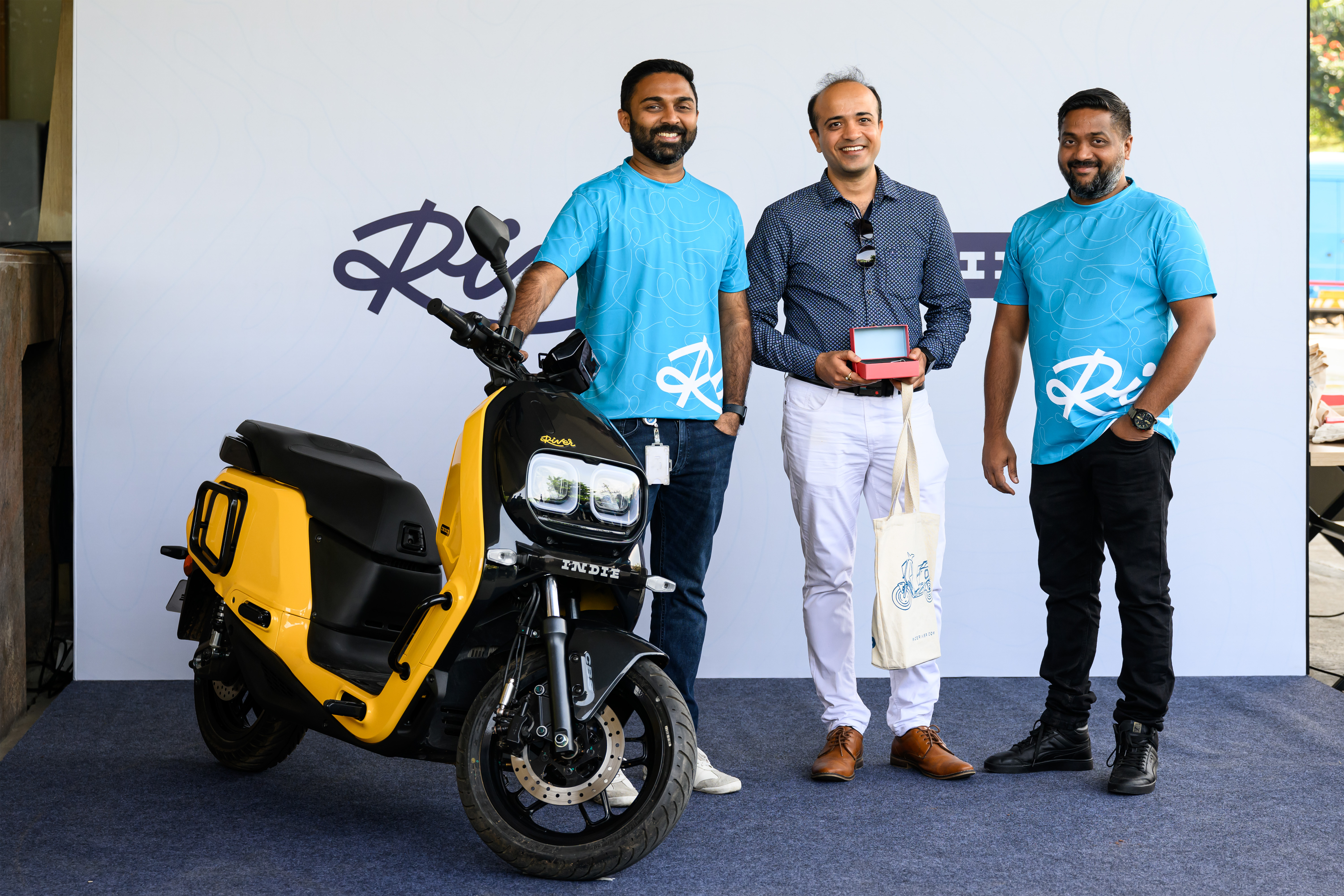 Aravind and Vipin with a customer